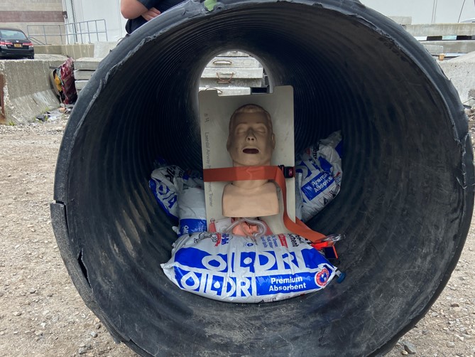 A simulated patient trapped in a confined space