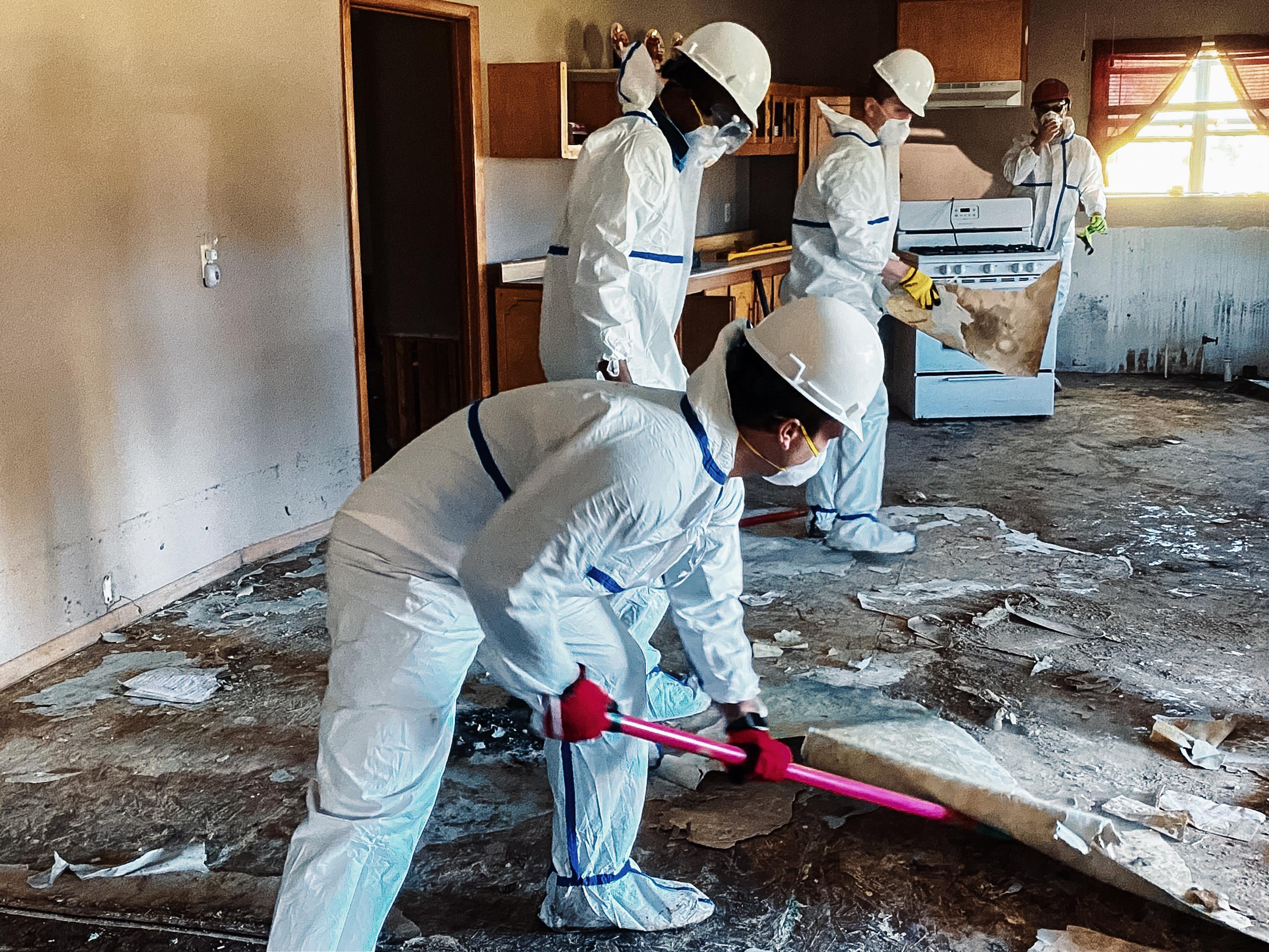 Tyvek suits are worn for a variety of missions, from cleaning muck out of flooded homes to assisting at COVID vaccination sites.