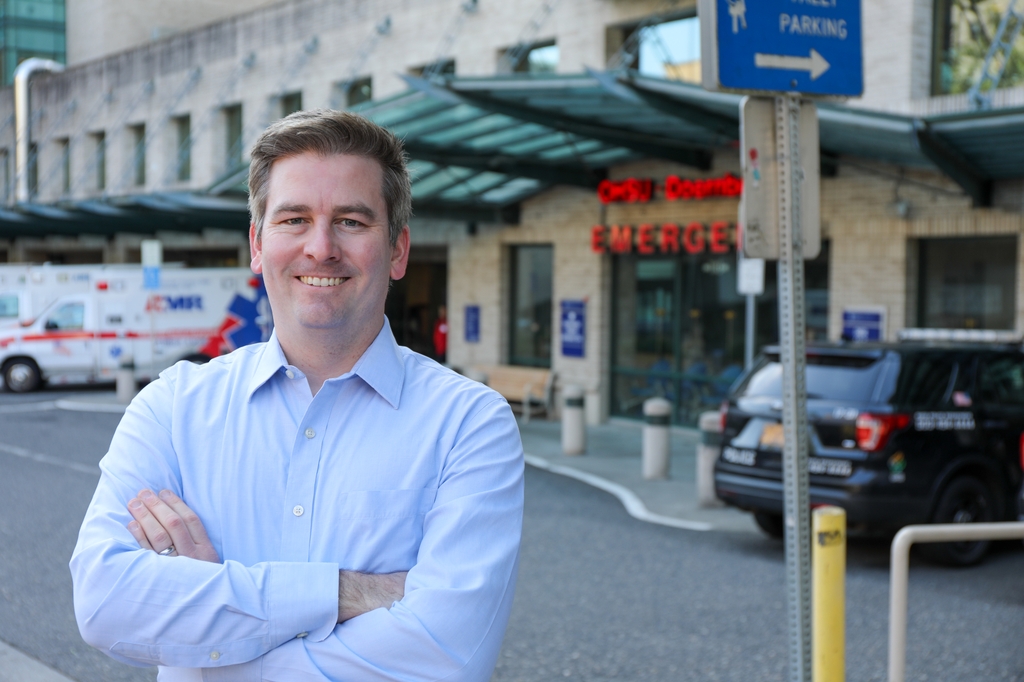 Joshua Lupton, M.D., a survivor of cardiac arrest, is the lead author on a new study from Oregon Health & Science University suggesting the initial placement of defibrillator pads could make a significant difference in returning spontaneous blood circulation to people in cardiac arrest. (Christine Torres Hicks/OHSU)