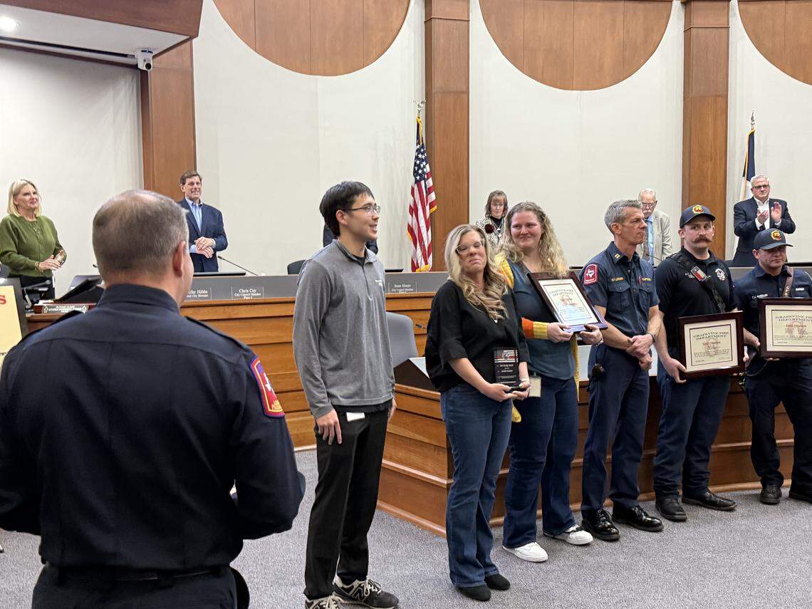 Members of the Grapevine Parks and Recreation team, the dispatch alarm team, and members of the fire department were recognized by Assistant Fire Chief, Wes Williams at the Feb 3 city council meeting for saving the life of Zach Smith (left gray sweater) who went into cardiac arrest at The REC in Grapevine on December 15.