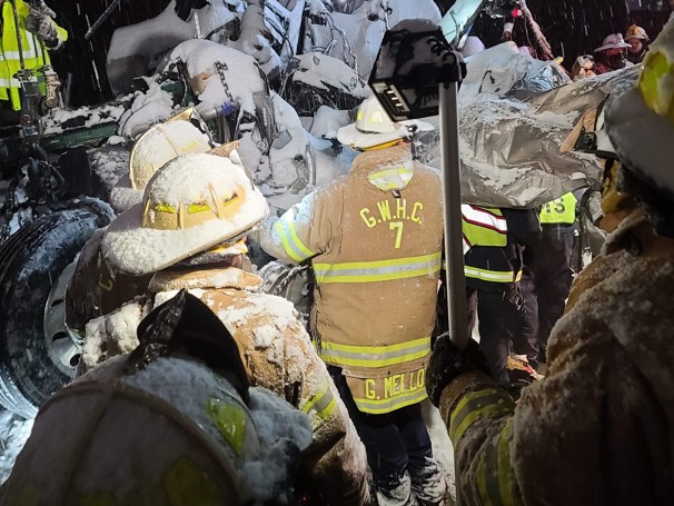 The patient's Jeep was under two tractor trailers, with the engine of a third lodged into its front. (Photos: Nick Mills, Brandon Myers) 