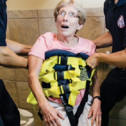 The Binder Lift wraps around the patient’s torso, providing 24–32 handles so providers can lift collectively from a range of angles. (Photo: Binder Lift)