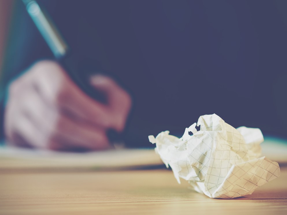 Photo of crumpled up paper on desk