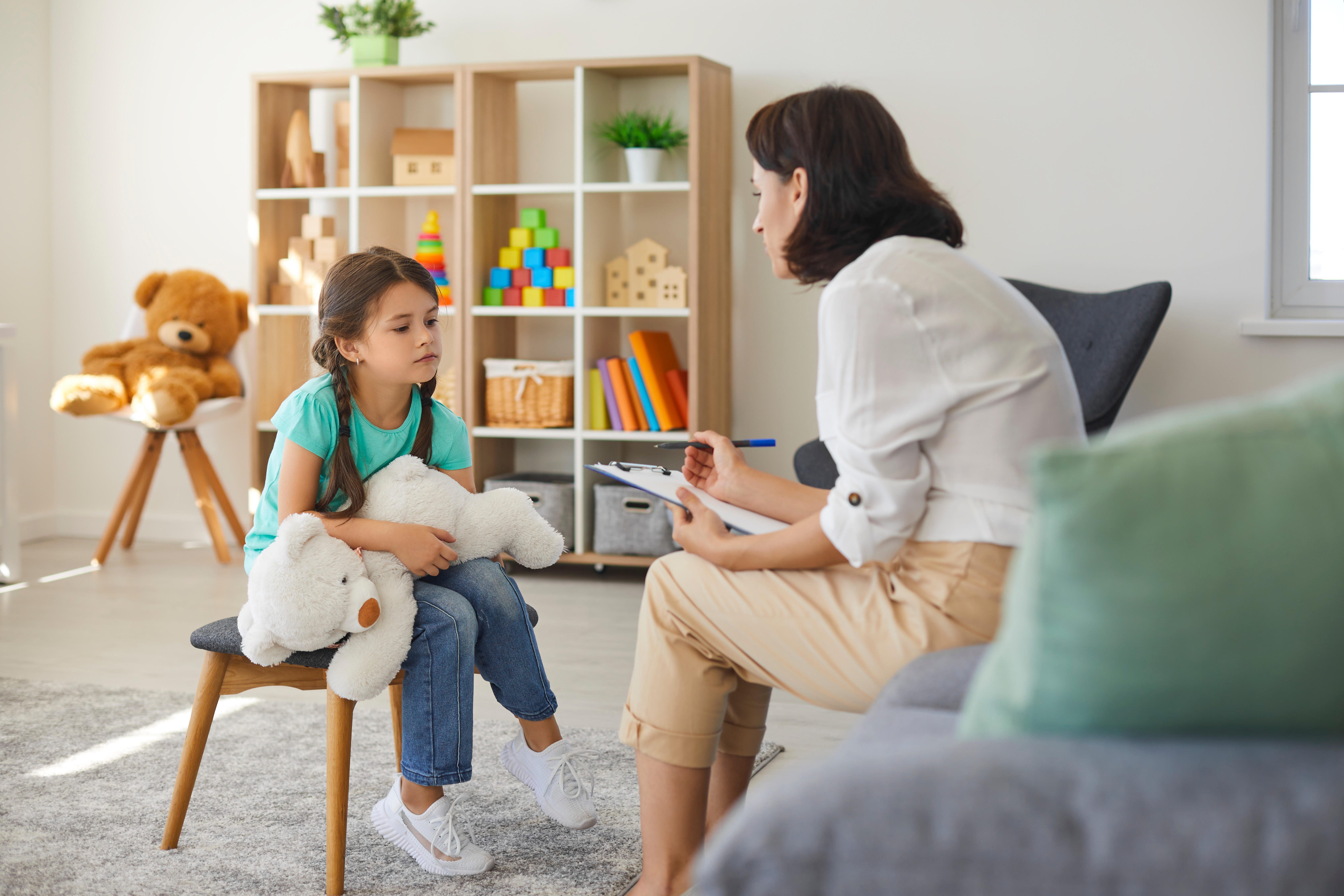 child talking with therapist