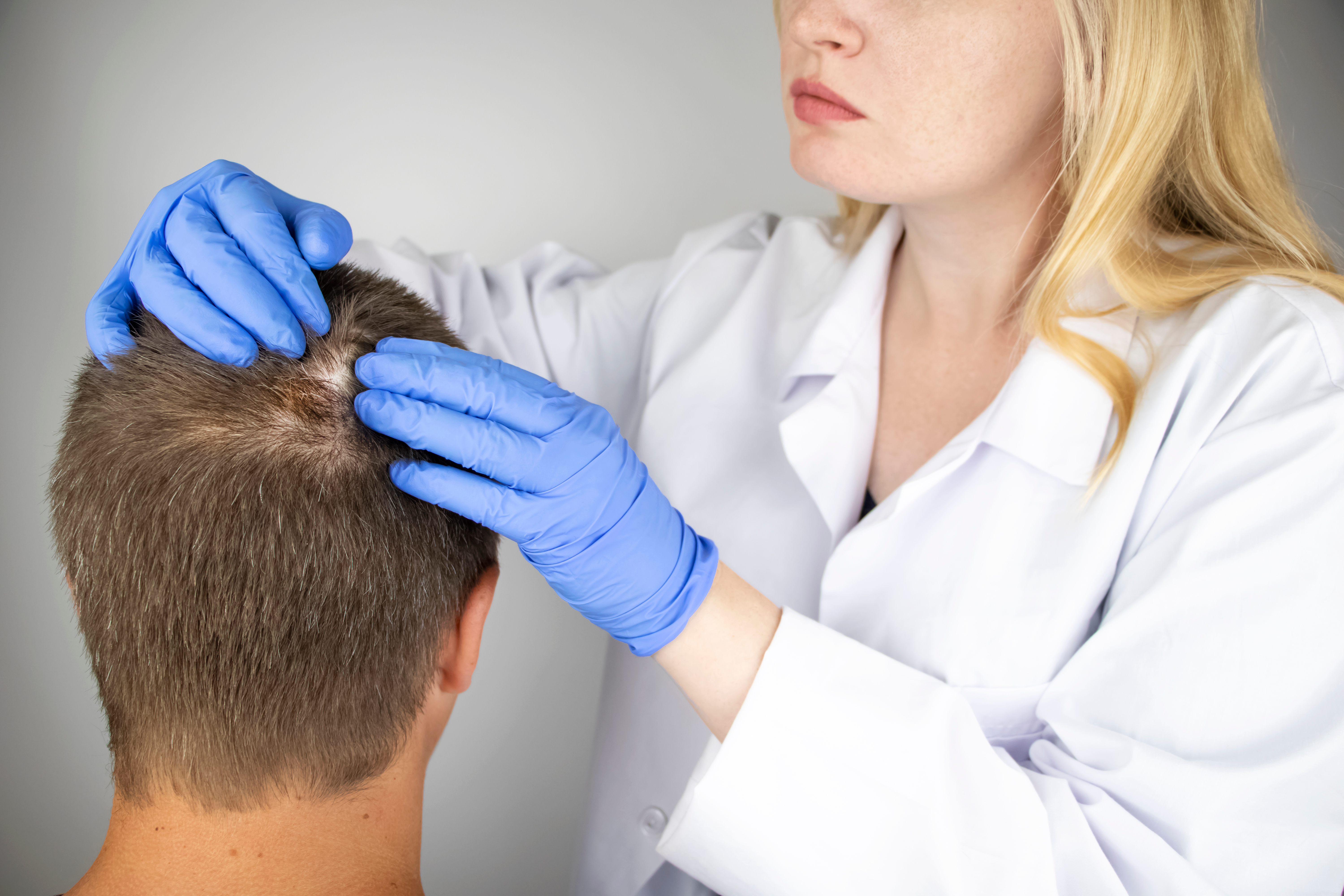Doctor examining AA patient