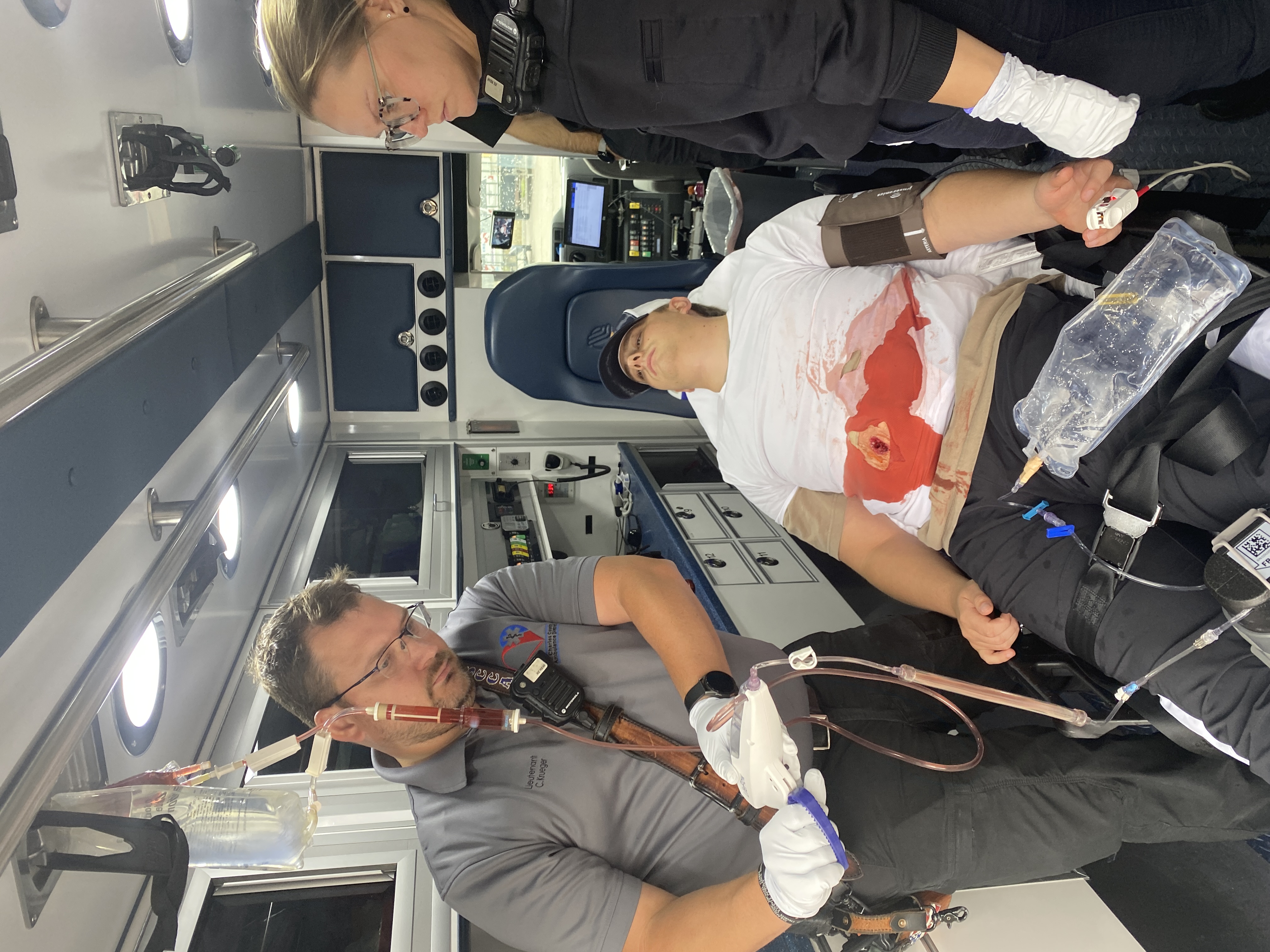 paramedics train on transfusion equipment