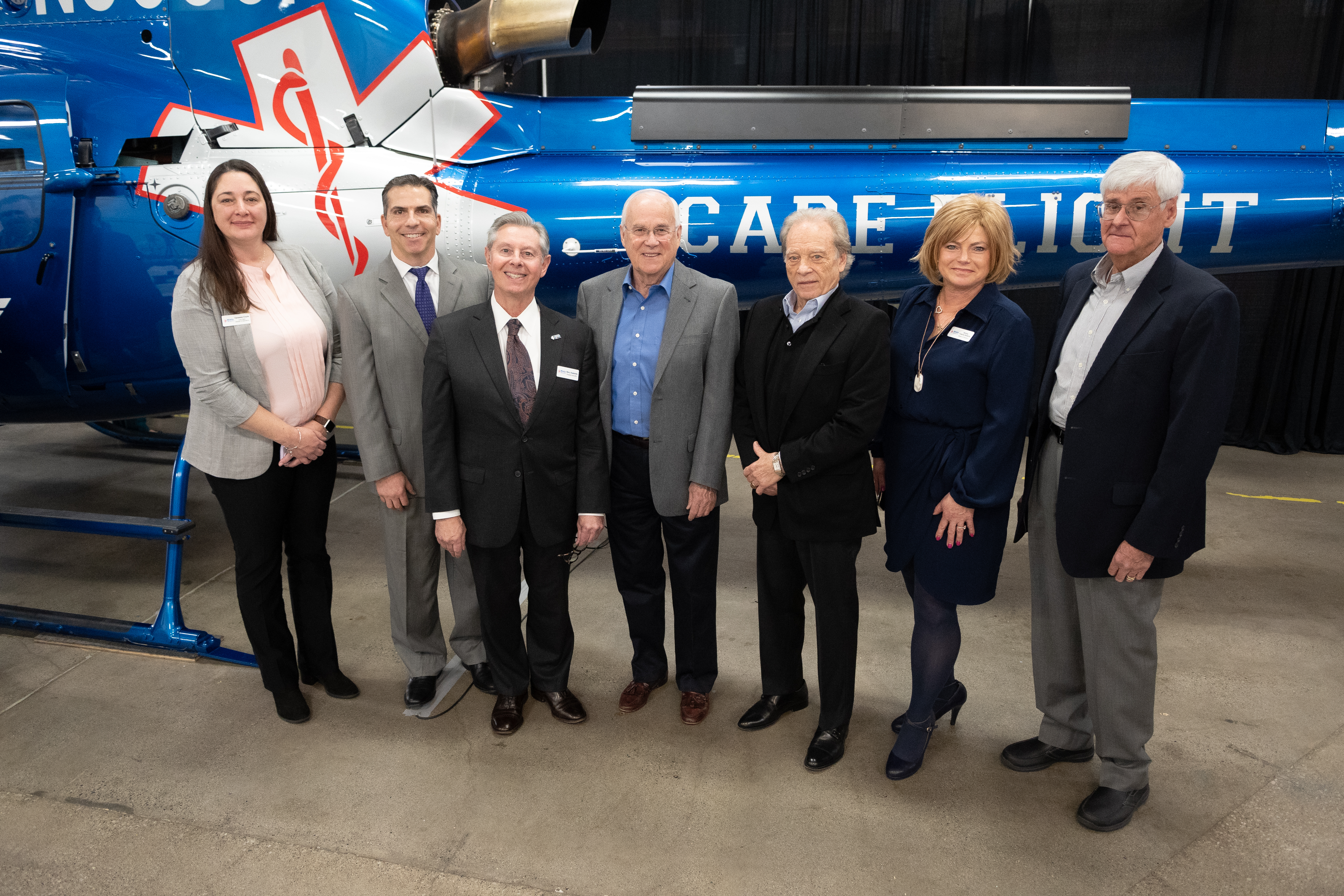 From left, Director of Care Flight Operations Vanessa Coyle, Vice Chair of the REMSA Health Board of Directors Michael Pagni, REMSA Health President and CEO Barry Duplantis, William N. Pennington Foundation Directors Rick Banis and Fred Scarpello, Chair of the REMSA Health Board of Directors Shirley Folkins-Roberts and Secretary of the REMSA Health Board of Directors Louis Test, appear with the new Care Flight 1 helicopter during an event celebrating its arrival at the REMSA Health campus Wednesday, Jan. 24, 2024, in Reno, Nev.