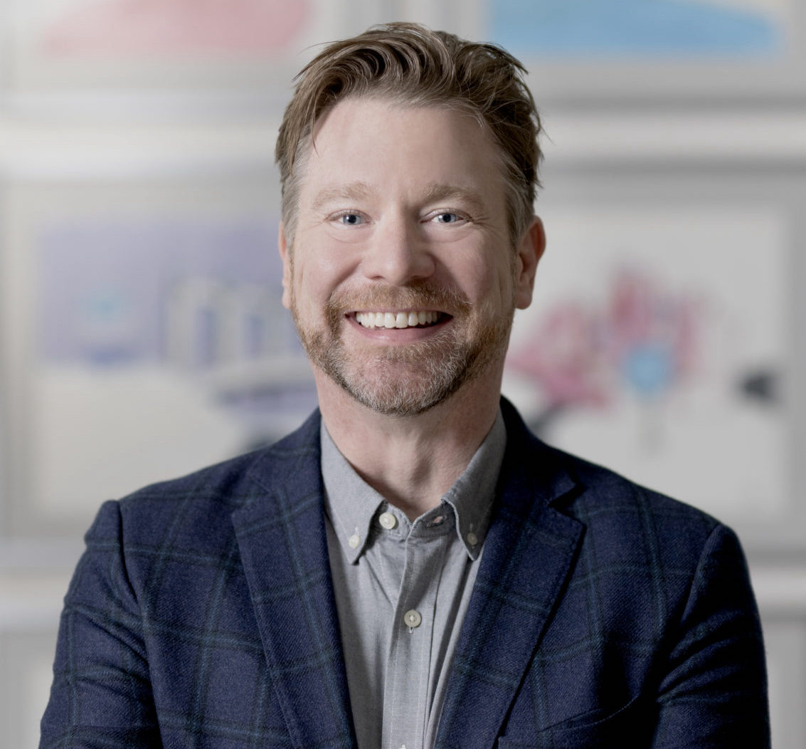 Headshot of Cory Busse, Icario