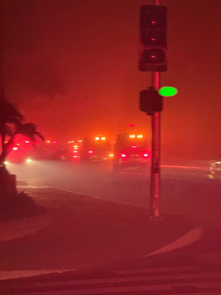 an ambulance strike team heads into the Eaton fire zone