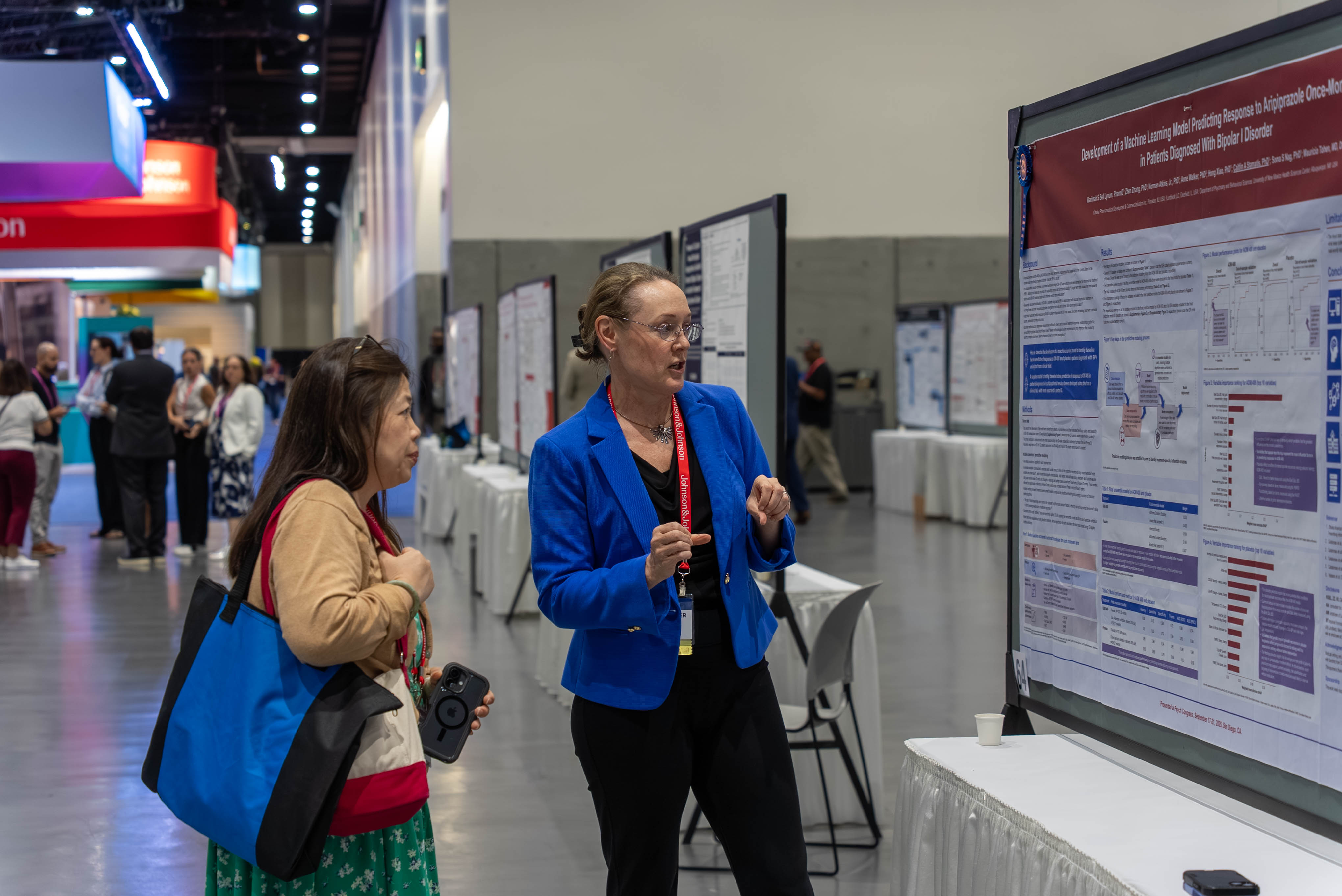 Attendees at Psych Congress look at research posters