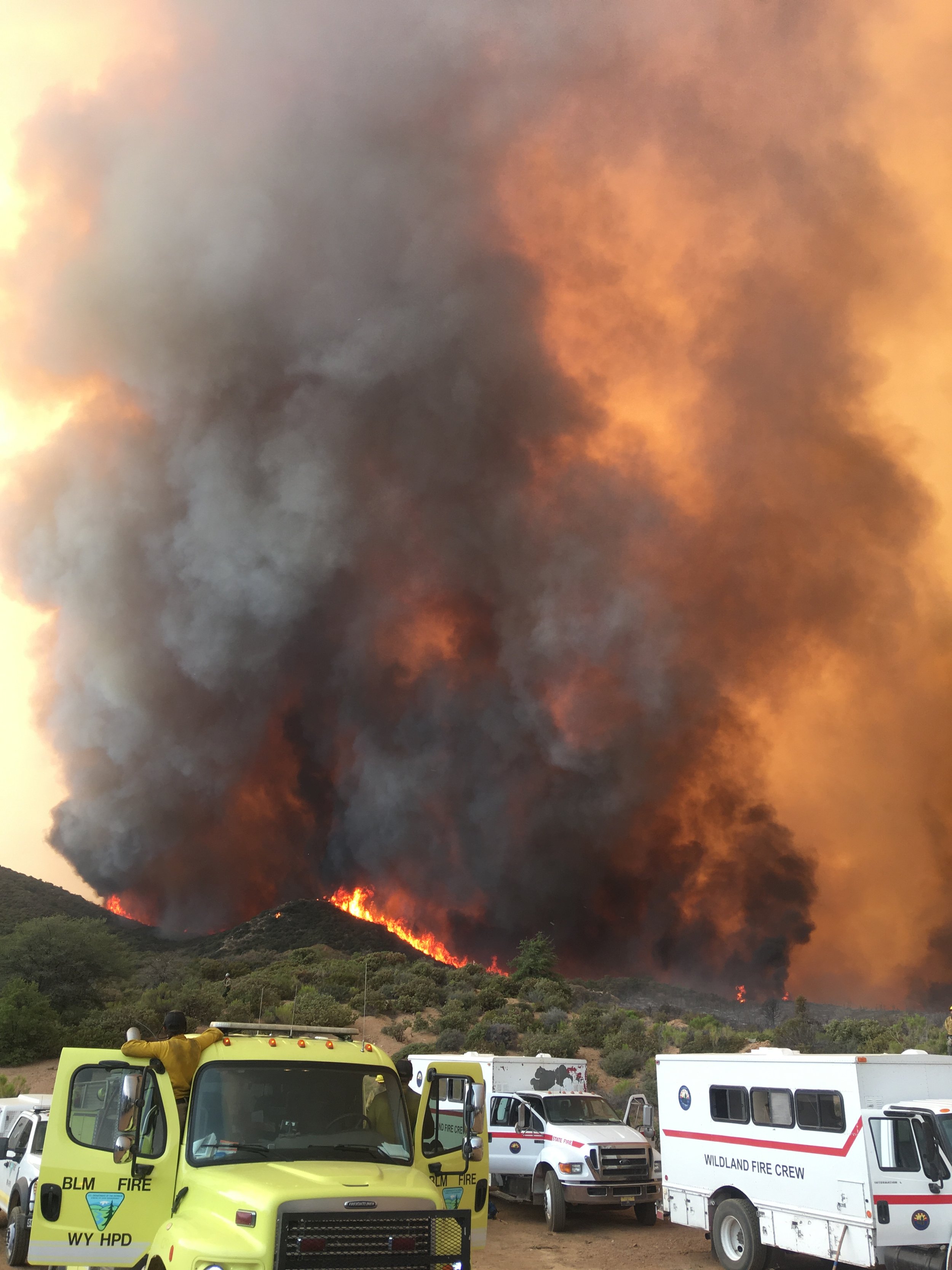 wildfire with first responder vehicles