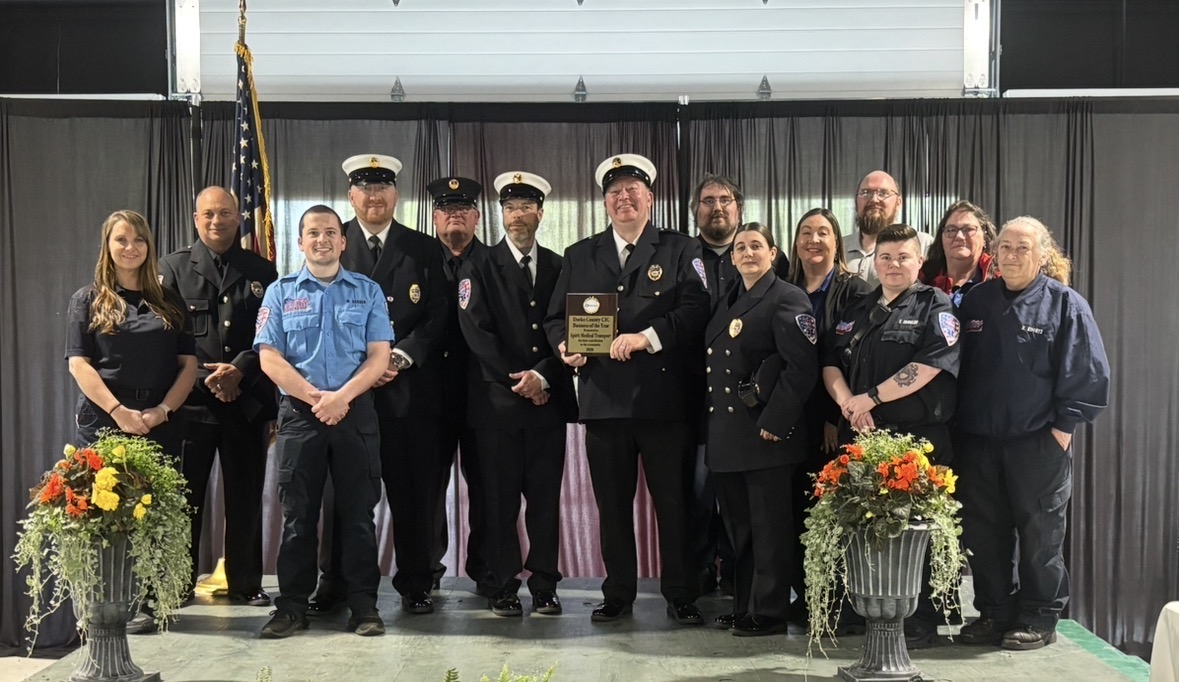 Representatives from Spirit EMS accepted the Darke County Economic Development Business of the Year award, including (front row, from left) Captain Will Gardam, Executive Administrative Assistant Amanda Fore, EMT Trista Endsley, and EMT Michelle Koontz; (second row) CDST Director Sarah Stump, Interim Chief of Employee and Facility Outreach Brian R. Brown, Vice President Aaron Guthrie, President/CEO Brian K. Hathaway, Employee Relations Coordinator Larissa Winchester, and Driver Melissa Ramsey; and (back row, from left) Interim Operations/Project Manager Curt Garrison, Director of HR/Regulatory Affairs Ted Bruner, EMT Dan Hittle, and EMT Jacob Miller.