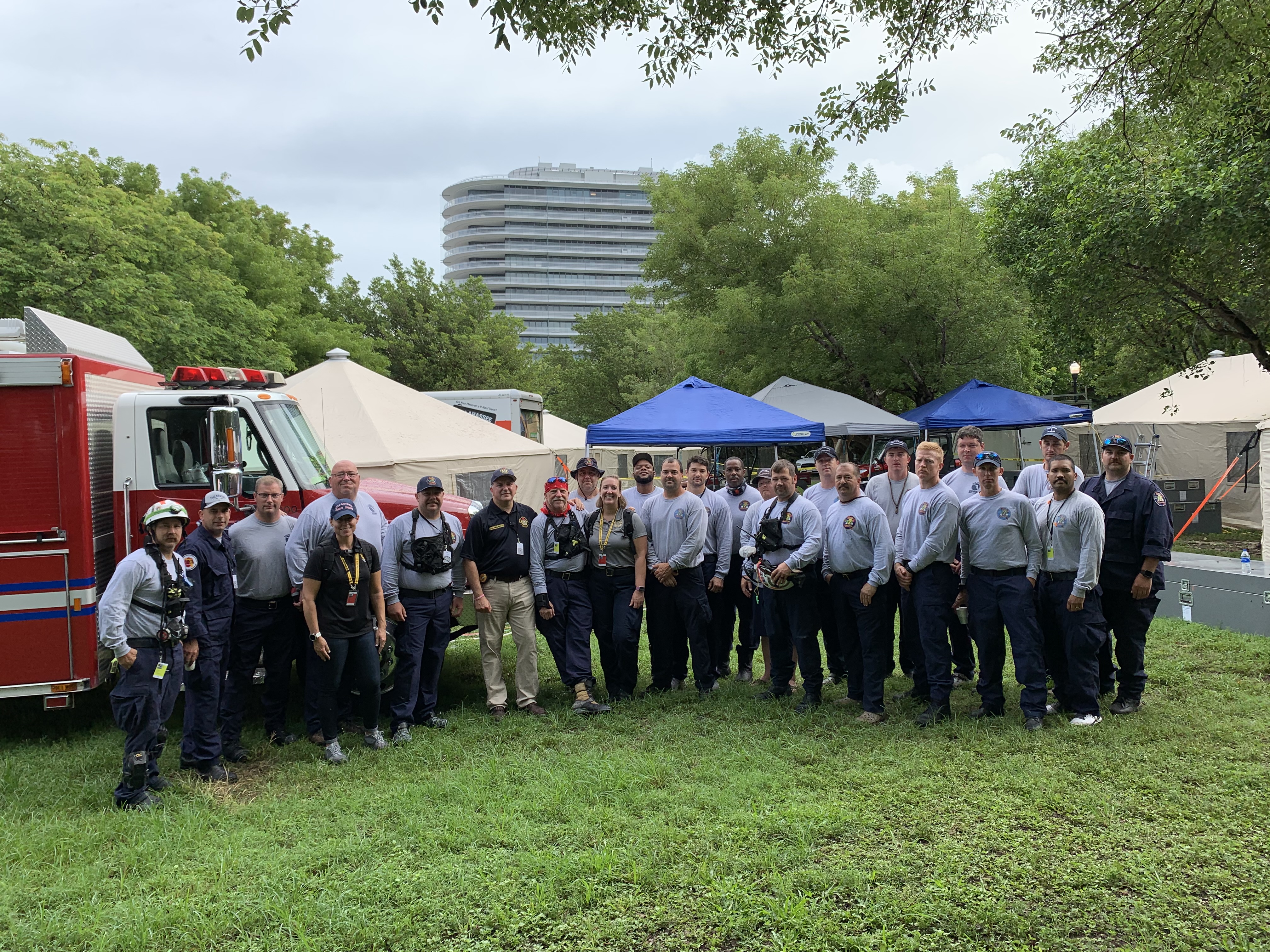 Team members work with Urban Search and Rescue (USAR) teams and State of Florida CFO Jimmy Patronis during Chaplain Towers building collapse deployment in 2021