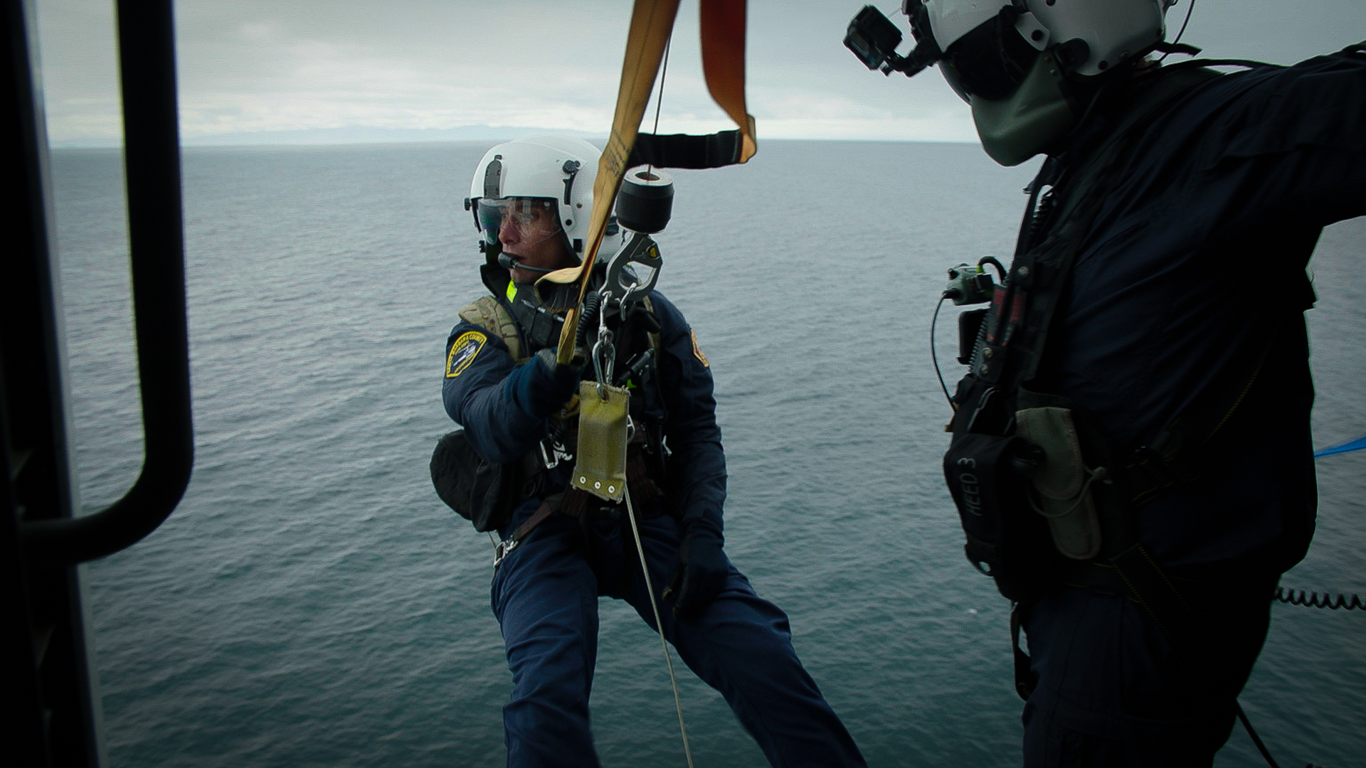 still from into the unknown showing a paramedic performing a water rescue
