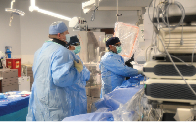 Saqer Alkharabsheh, MD, Mevan Wijetunga, MD, and Ryan Meuhlberg, RT(R), performing PVC ablation. 