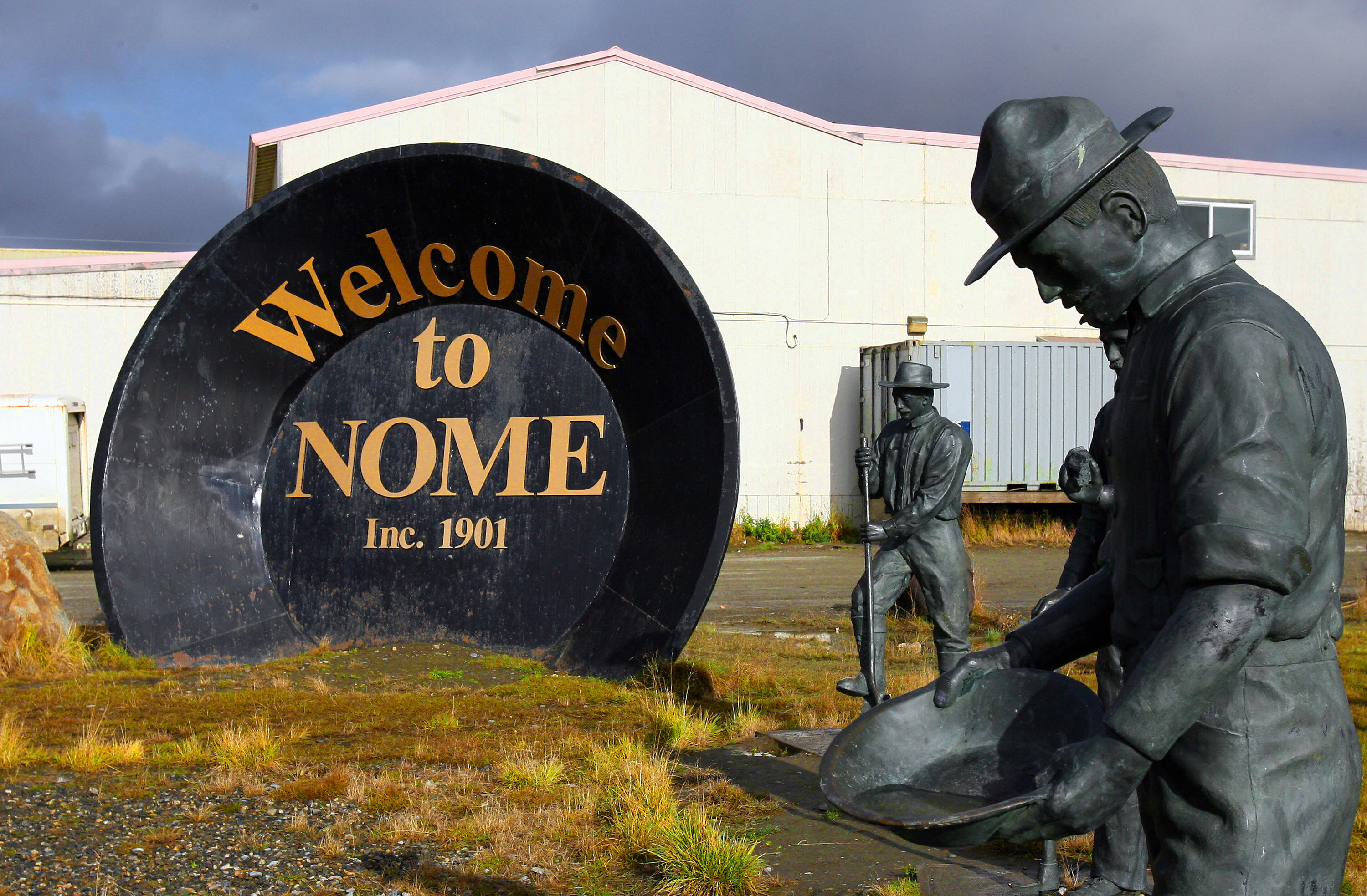 A giant gold pan welcomes visitors to Nome, Alaska, 29 Sept. 2006. The discovery of gold by Norwegian Jafet Lindeberg and Swedes Erik Lindblom and John Brynteson in 1898 in nearby Anvil Creek, led to the founding of Anvil City, later renamed Nome. The city, 200 miles (321kms) from the Russian east coast and 560 miles (901kms) northwest of Anchorage, also claims the finish line of the Iditarod Trail annual dog sled race.