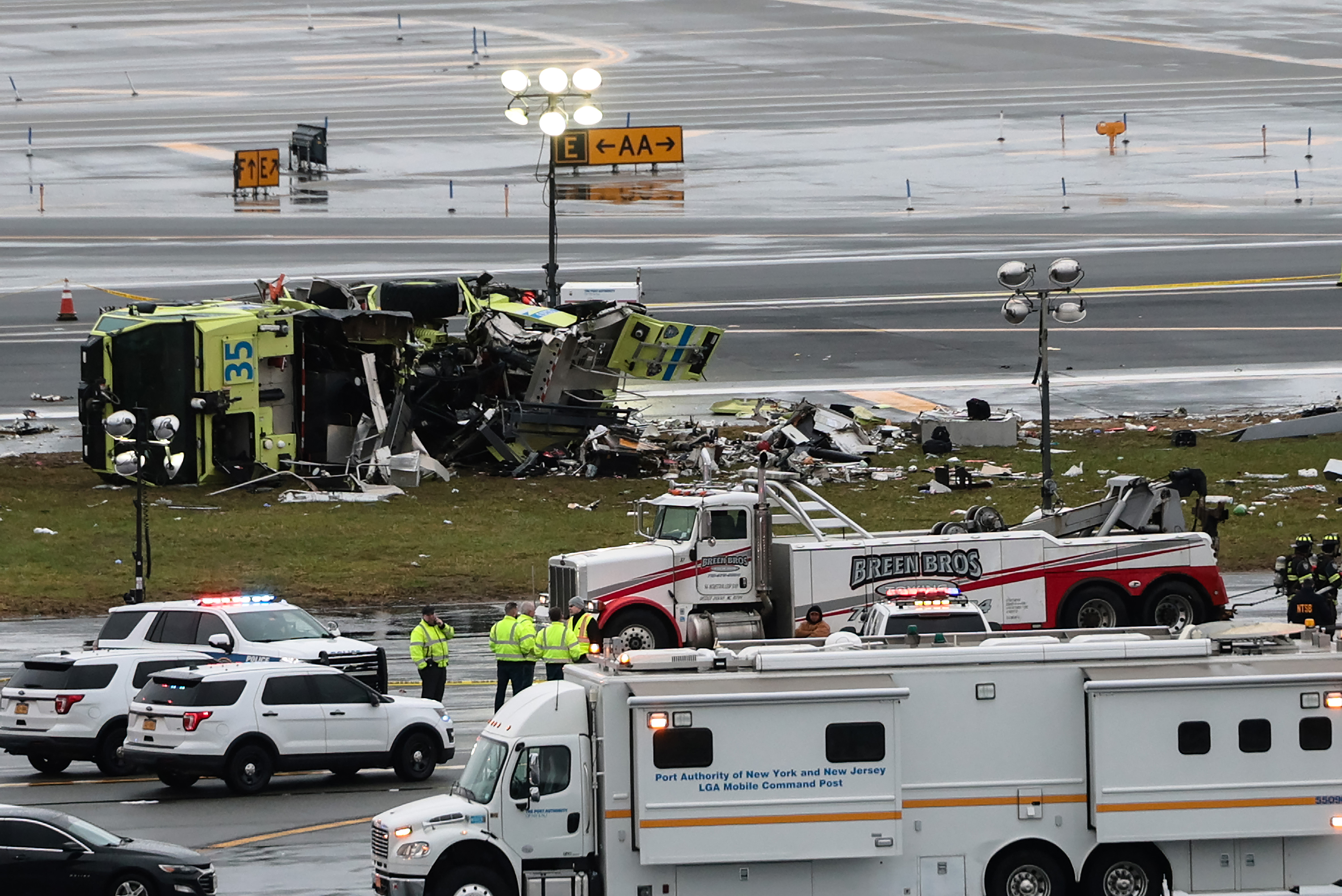 An a Port Authority fire truck sits on the runway after colliding with an Air Canada Express CRJ-900 at LaGuardia Airport on March 23, 2026, in New York City. All flights into and out of LaGuardia airport have ben cancelled until 2 P.M. after an Air Canada Express plane flight from Montreal collided with a fire truck on the tarmac killing the pilot and leaving more than forty people injured. (Michael M. Santiago/Getty Images/TNS)