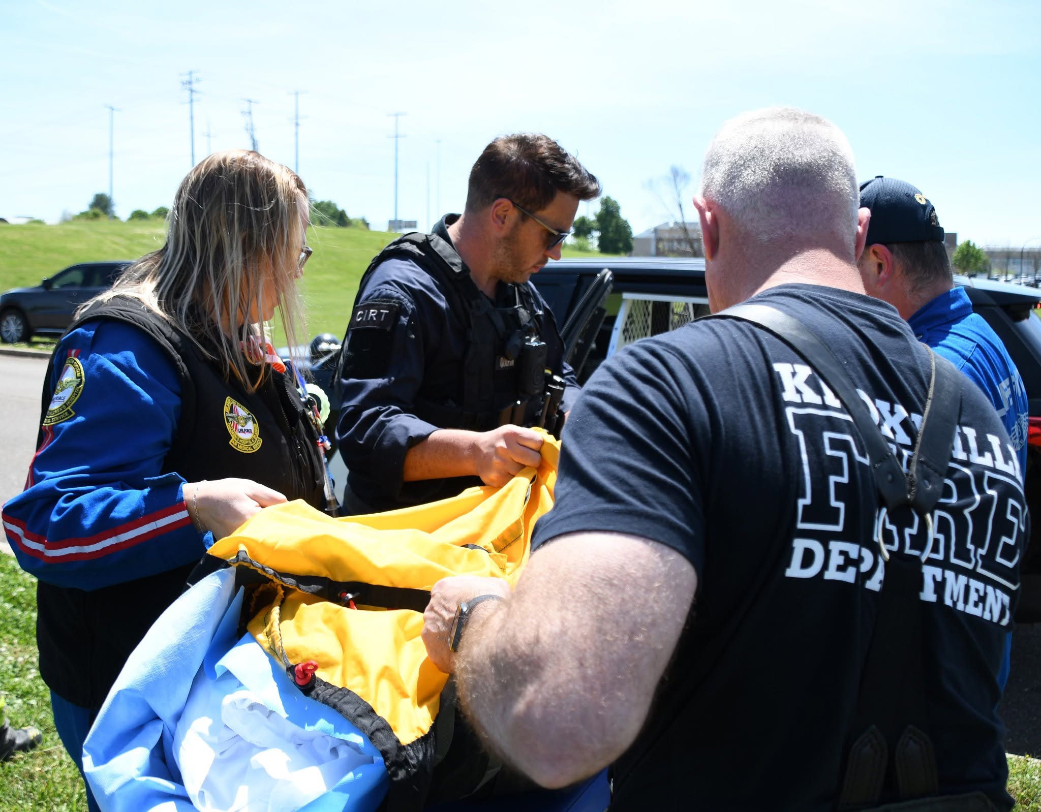Crew unloading the K-9 at UTCVM with their help.
