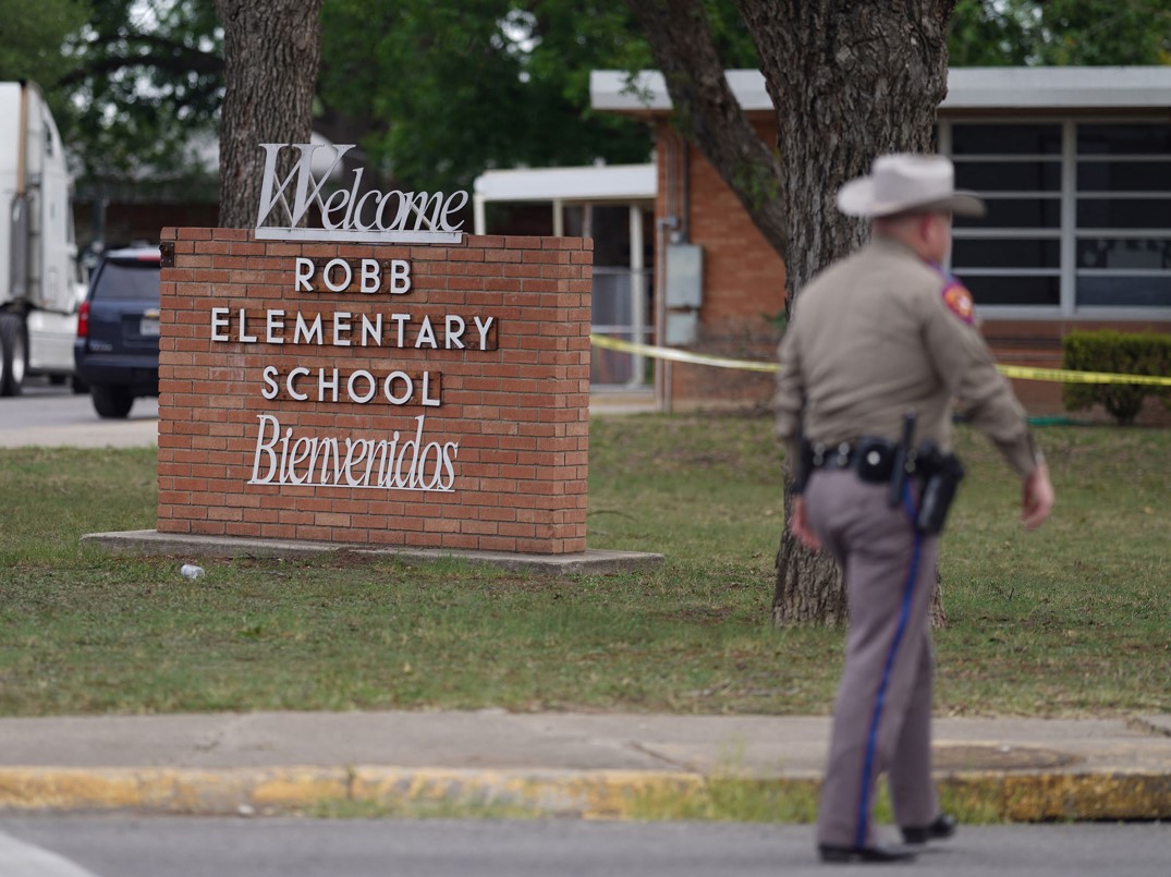 An officer walks outside of Robb Elementary School in Uvalde, Texas, on Tuesday, May 24, 2022. (Photo: Allison Dinner/AFP-Getty Images-TNS) 