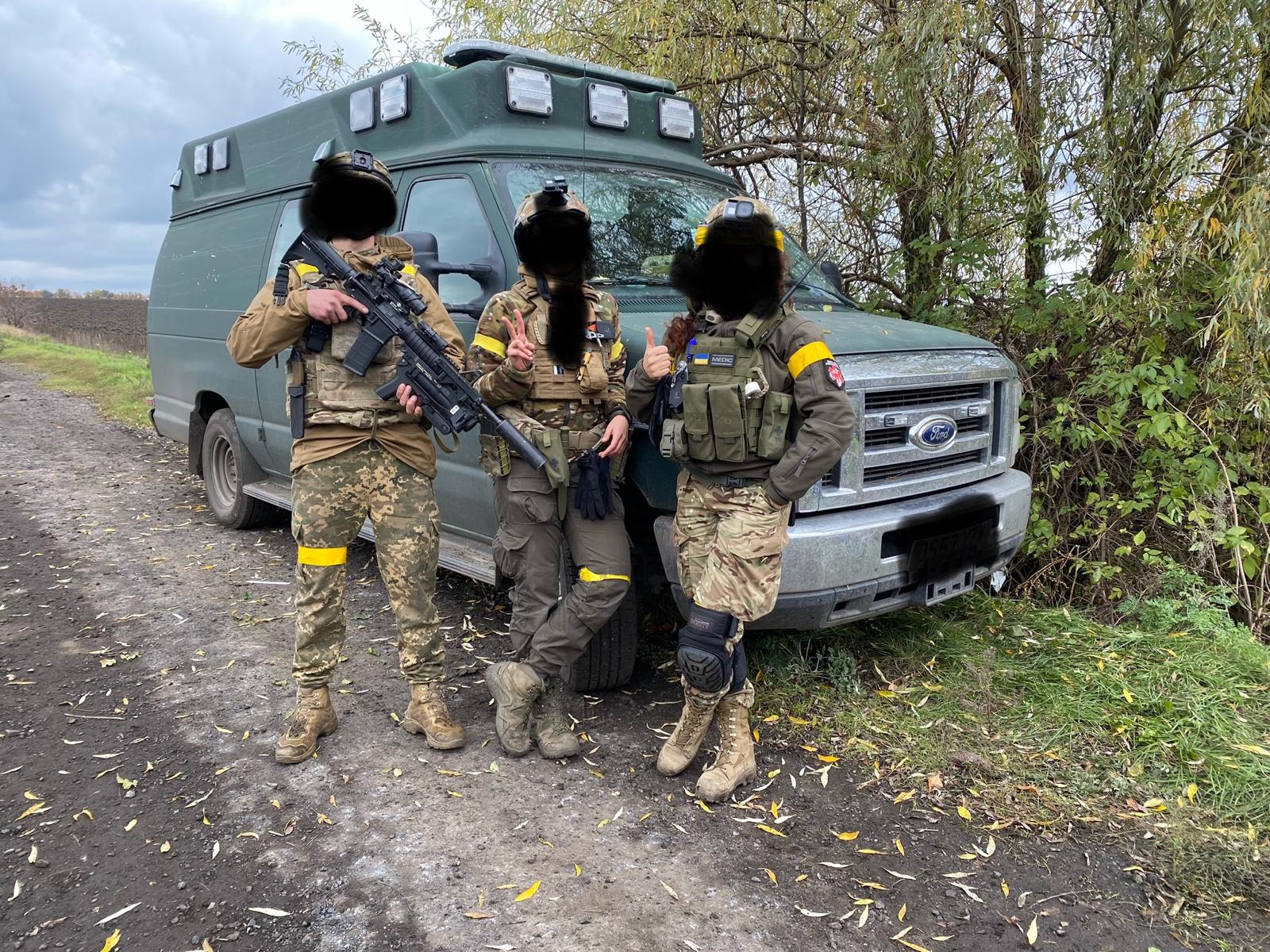 Ukrainian medics with donated ambulances.