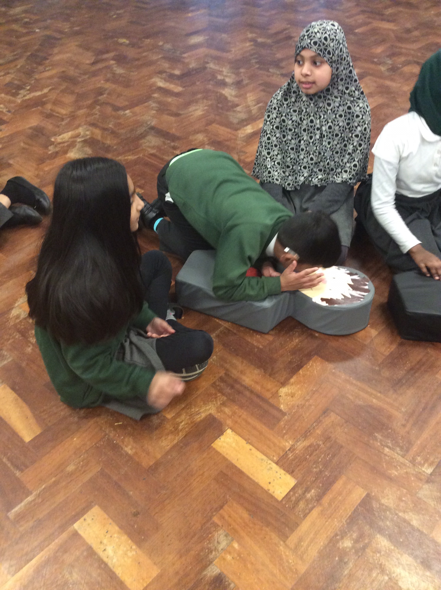 Children practicing first aid