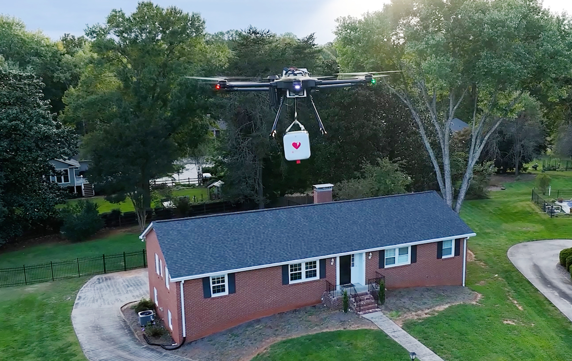 An AED toting Drone delivers to a house