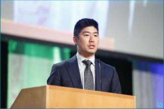 Dr Brian Kim at the podium