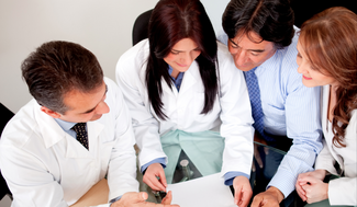 doctors crowding over literature