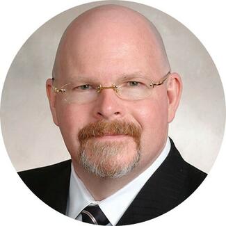 Headshot of Dr William Kokal