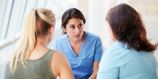 Doctor talking to patients