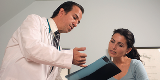 doctor explaining chart to patient