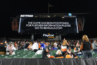 An announcement is displayed on the scoreboard as the game between the Cincinnati Bengals and the Buffalo Bills is postponed following the injury of Damar Hamlin (3) of the Buffalo Bills during the first quarter at Paycor Stadium on Monday, Jan. 2, 2023 in Cincinnati. (Dylan Buell/Getty Images/TNS)