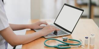 laptop with stethoscope