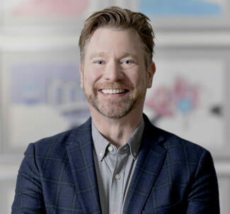 Headshot of Cory Busse, Icario