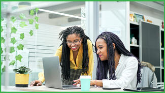 Two women at a computer