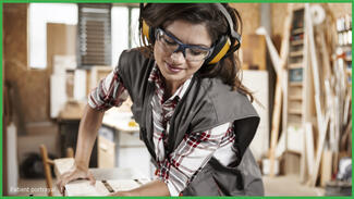 Adult woman doing woodworking