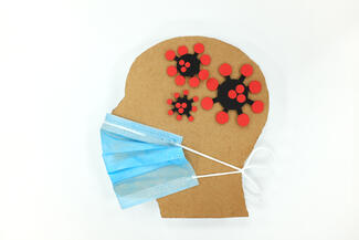 An illustrated face in profile, wearing a mask