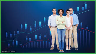 Adults standing with a graph in the background