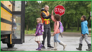 Kids getting on school bus