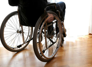 a patient sits in a wheelchair