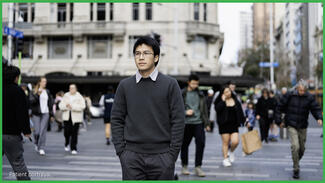 man walking alone down a crowded street