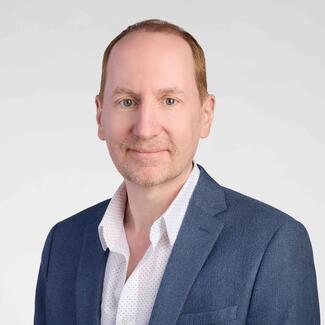 Sacha Gnjatic headshot on white background