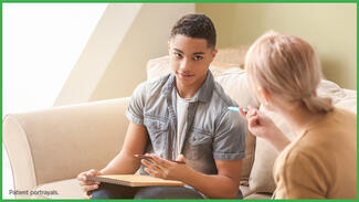 A student with a copybook and pencil interacting with an adult
