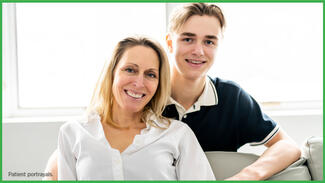 A mother and son smile for the camera