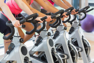 A set of cycling bikes at the gym