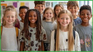 A group of smiling children in a classroom