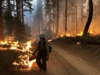 Kelly Ramsey fighting a fire