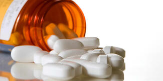 open and spilled bottle of pills