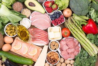 a nutritious grouping of food included vegetables, fruits, nuts, and lean poultry