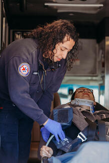 restrained patient with c-collar